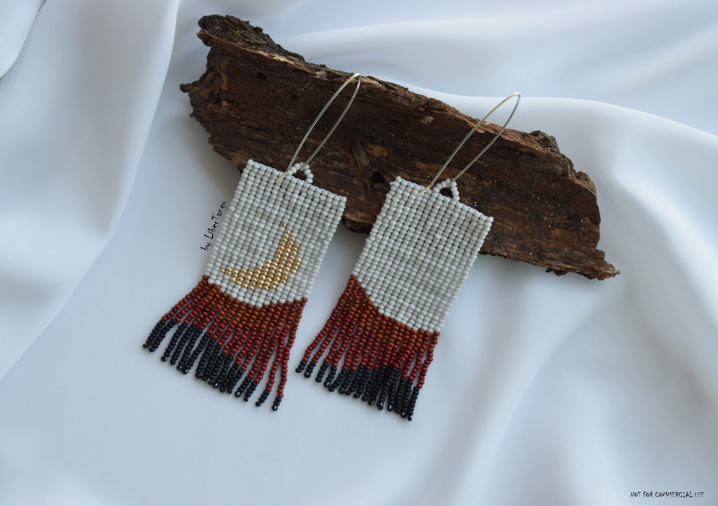 Brown beaded earrings with mountains print