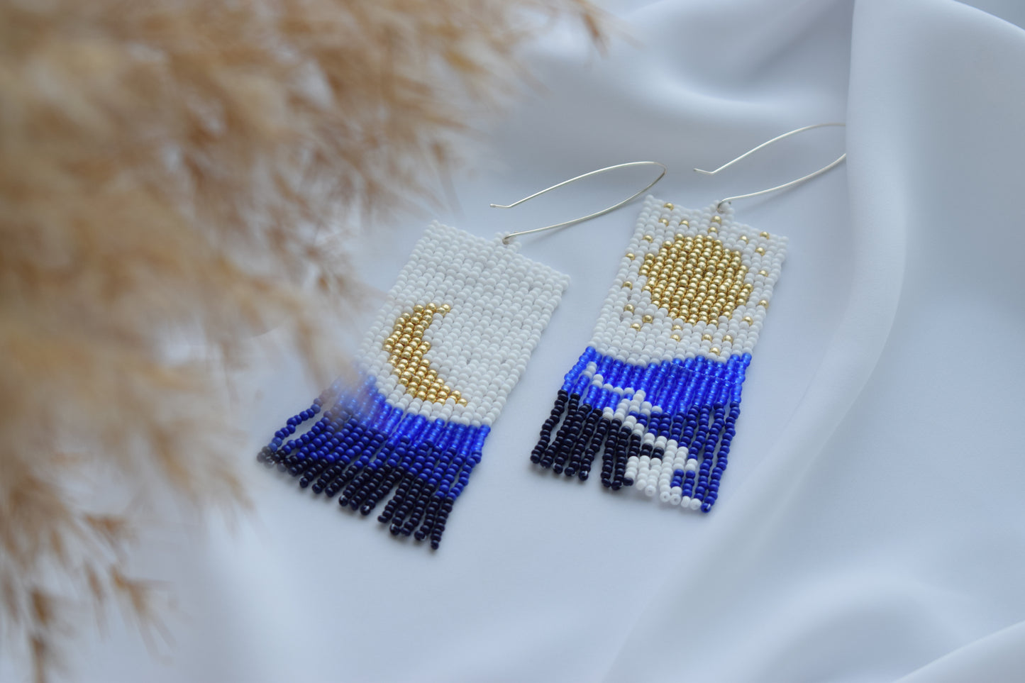 Navy blue beaded earrings with mountains print