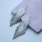 White and silver fringe bead earrings in minimalist style