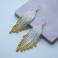 White and gold fringe bead earrings in minimalist style