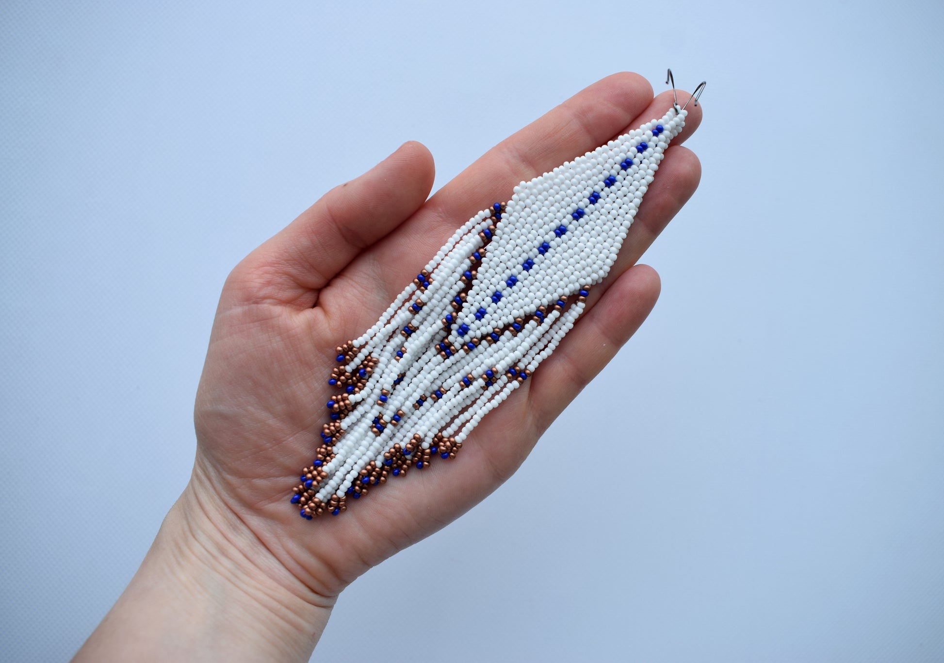 These are white and navy blue beaded earrings.