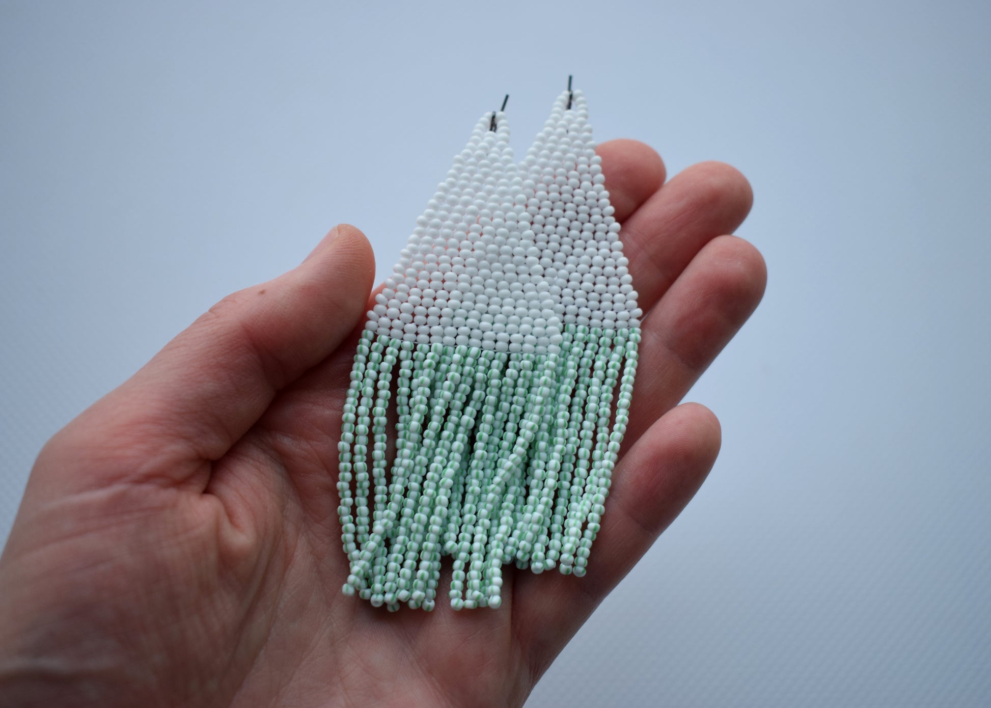 White and green beaded earrings