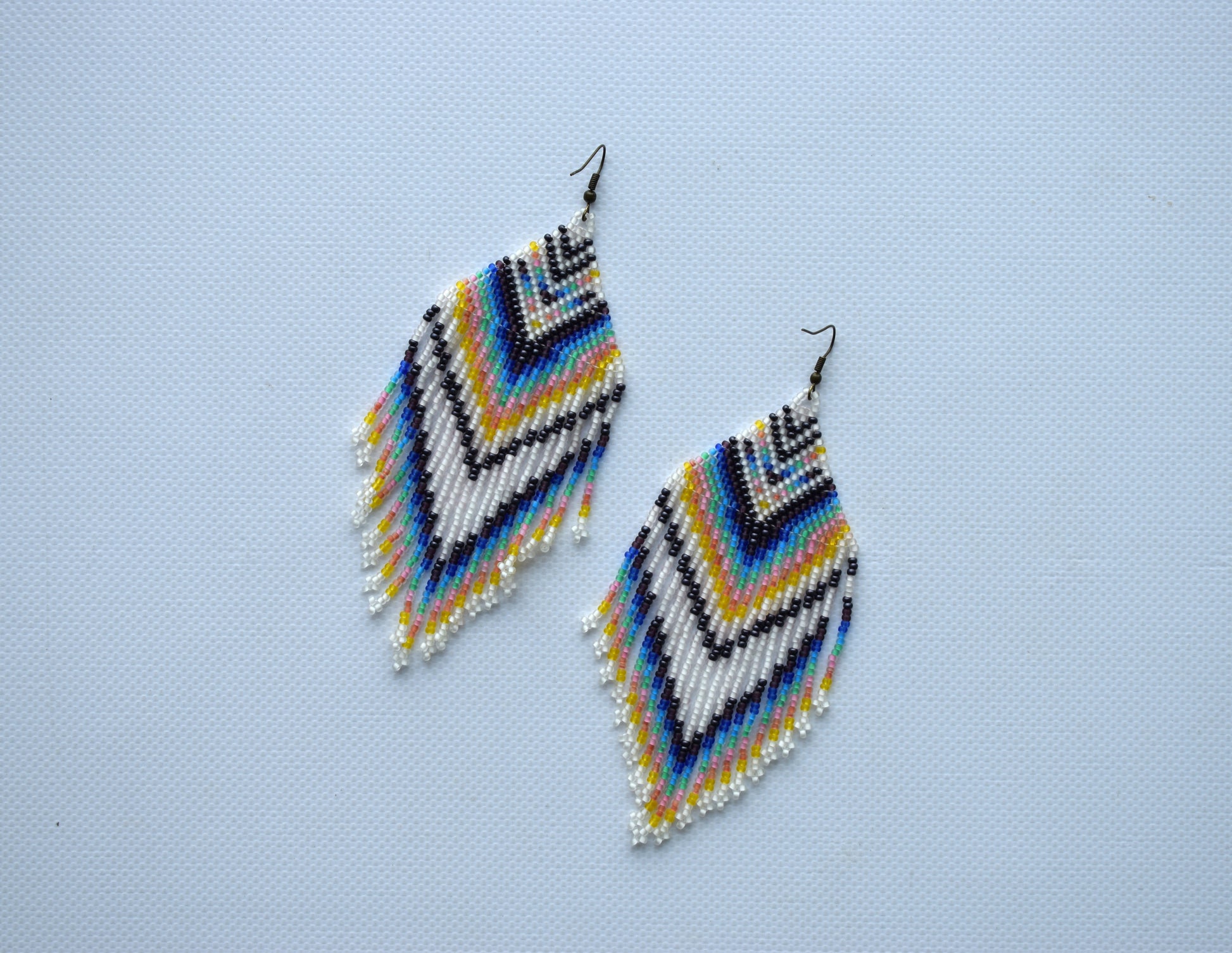 These are beaded earrings in Bohemian style. These beaded earrings are made of high-quality Czech beads. These earrings are extra long, colorful, delicate, fashionable and highly versatile, suitable for everyday wear.  Length (*with hooks) - 12.5 cm (4.9 inches). Width - 5 cm (1.9 inches).  If you have any questions just write me a message. I am always in touch and reply asap!