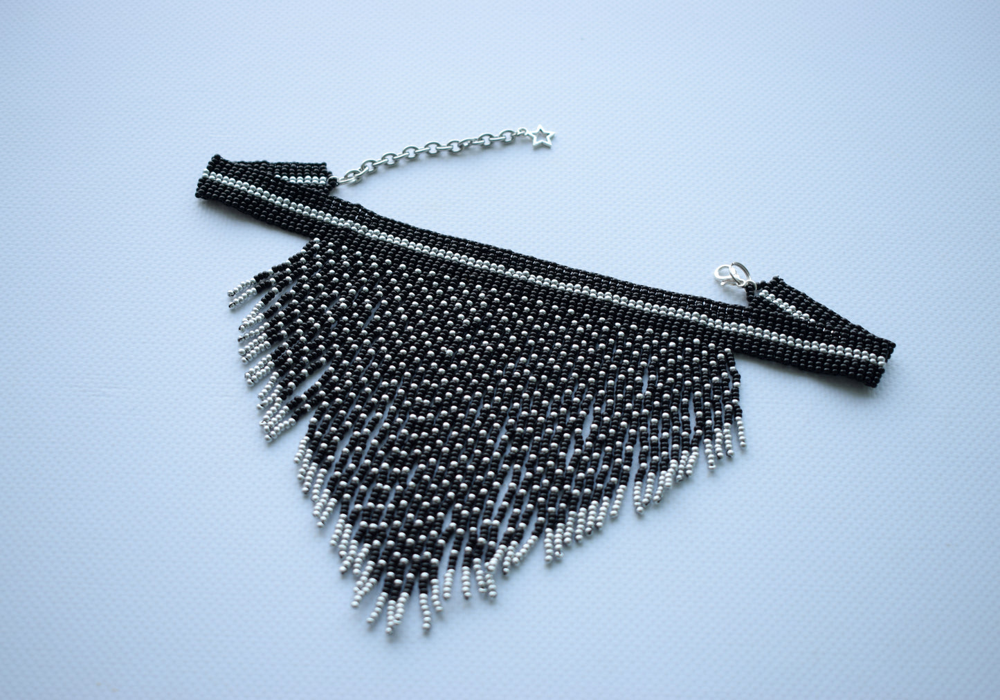 This is black and silver necklace with fringe. This beaded necklace is made of high-quality Czech beads. This necklace is exquisite and fashionable.  Completely handmade❤️  Length (neck girth) - 30 cm+chain (11.8 inches+chain). Length (beadwork part+fringe) - 12.5 cm (4.9 inches).  Message me if you need custom colors.  If you have any questions just write me a message. I am always in touch and reply asap!